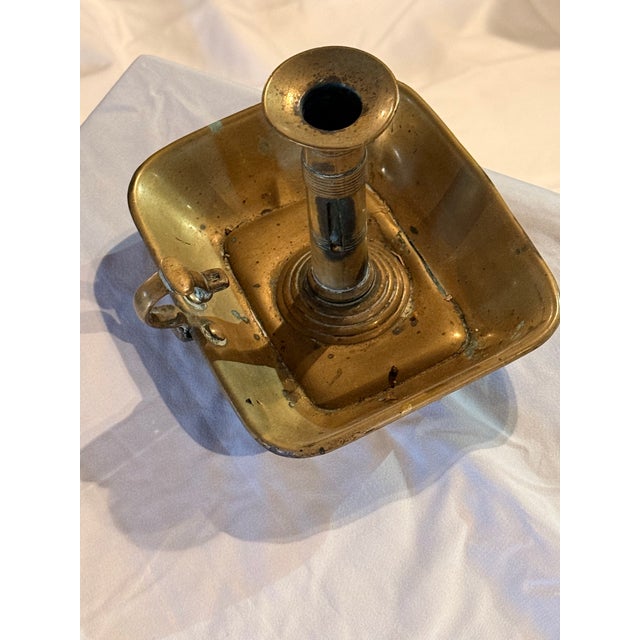 Beautiful aged brass with thumb grip and wax collection tray