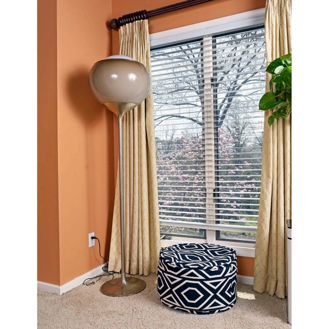 The "Bud Grande" tulip bulb lamp is a functional piece of art. A single light bulb is shielded by the original, elegant,...