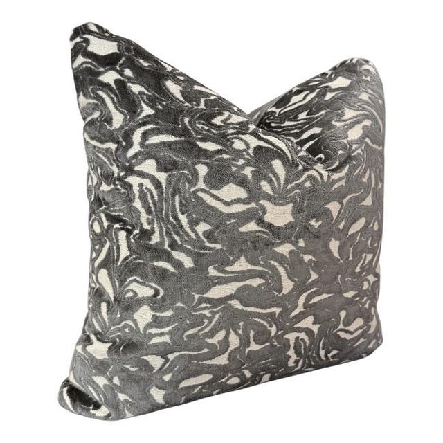 Elevate your space with this striking decorative pillow featuring a bold abstract pattern in rich charcoal and ivory...