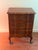 This pair of wooden nightstands features serpentine three-drawer design with carved drawer fronts., cabriole legs, and...