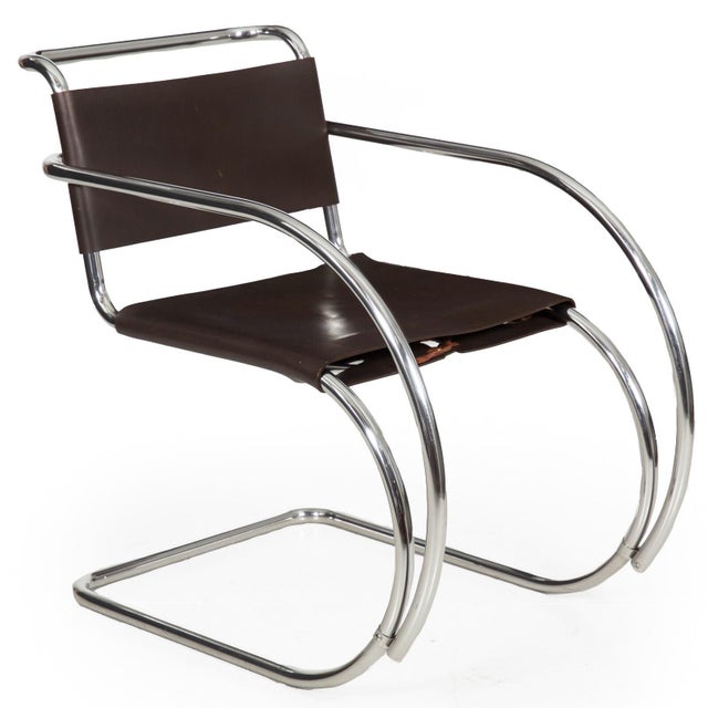 PAIR OF CHROME STEEL AND LEATHER MR20 ARMCHAIRS Designed by Mies van der Rohe, circa 1970s 31" H x 18 1/8" H to seat x 31...