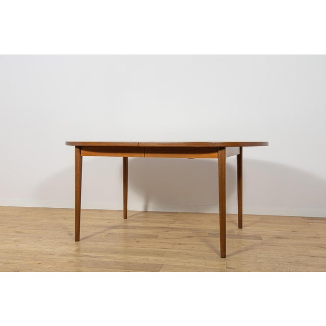 This large extending teak dining table was designed by Nils Jonsson for the Swedish furniture manufacturer Troeds Bjärnum...