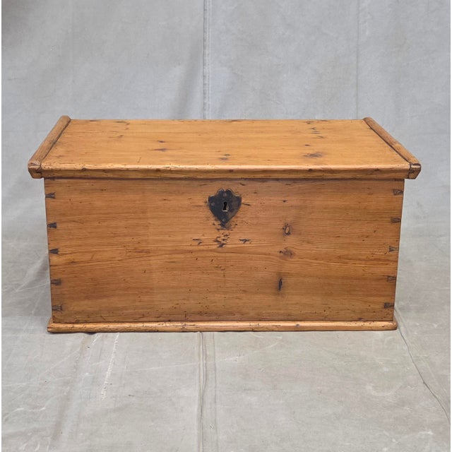 A charming and functional circa 1900 German natural pine storage box with oversized original iron key. Beautiful dovetail...