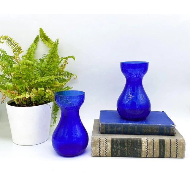 Gorgeous pair of hand made crackle cobalt glass vases with a lovely double gourd shape. Made circa the 1960s, these are a...