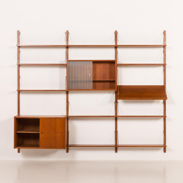 This elegant danish shelving wall unit was designed by preben sørensen and manufactured by ps system in randers in the...