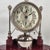 A large and wonderfully characterful antique alarm clock mounted on its original wooden pedestal, dating to 1903 and...