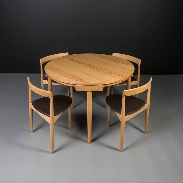 This dining set was produced in Denmark in the 1950s and reflects the design language associated with Hans Olsen. The set...