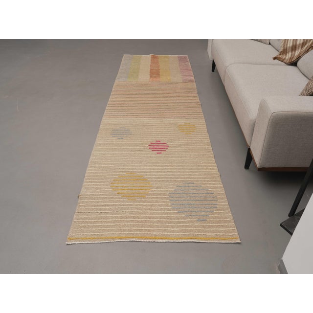 Vintage Hand-Knotted runner rug is a semi-antique vintage area rug. The '70s Eastern region of Anatolia's unique rug is...