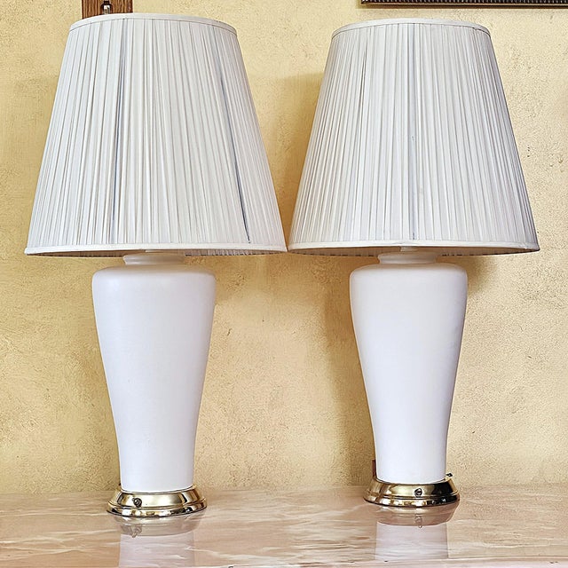 Pair of Vintage White Ceramic Urn Form Table Lamps This attractive pair of vintage ceramic table lamps features elegant...