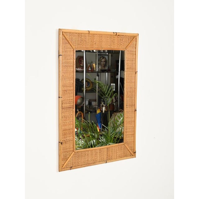 Wonderful Mid-Century large rectangular mirror entirely made of bamboo and woven rattan wicker. This beautiful French...