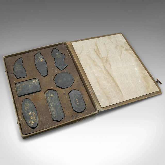 This is an antique set of calligraphic ink blocks. A Japanese, boxed set of 8 soot ink shapes, dating to the late...