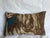 This elongated decorative pillow features a tapestry composition defined by richly layered, flowing forms that move...