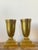 This elegant pair of vintage brass pedestal urns is a masterclass in Hollywood Regency glamour and Art Deco-inspired...