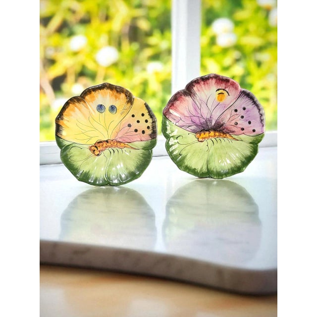 This product is a vintage pair of Italian majolica hand-painted luncheon dessert plates featuring a butterfly pattern. The...