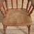 A charming windsor spindle kitchen carver chair with solid elm seat, raised on turned ash supports with h framed...