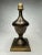 There’s a soft satin sheen on this mixed metal bronze and brass finish finial in bronze. Its' style leans toward a...