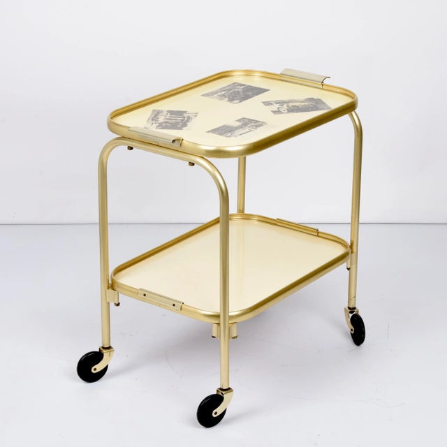 Unique mid-century golden aluminium and formica vintage cart. This fantastic item was produced in Italy during the 1950s....