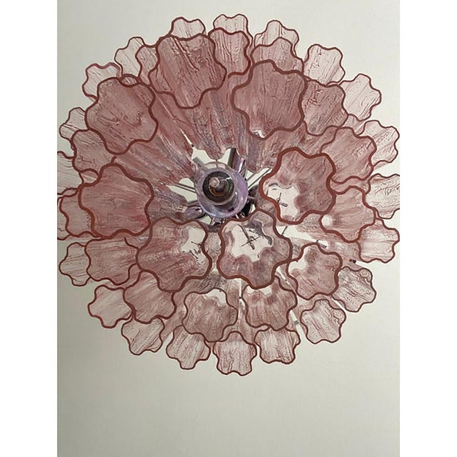 Contemporary pink “tronchi” murano glass chandelier with a chromed belt. “tronchi”are blown inside a wooden mold, into...