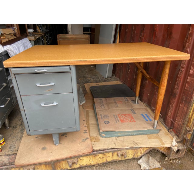 Vintage mid century modern metal tanker desk with heavy duty wooden top , has some surface wear and some dings and marks ,...