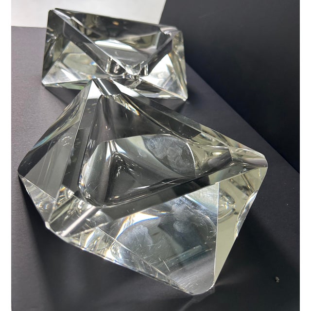 These 1960's mid-century modern ashtrays are from Murano glassmakers. It's geometric multi-faceted silhouette, showcases...