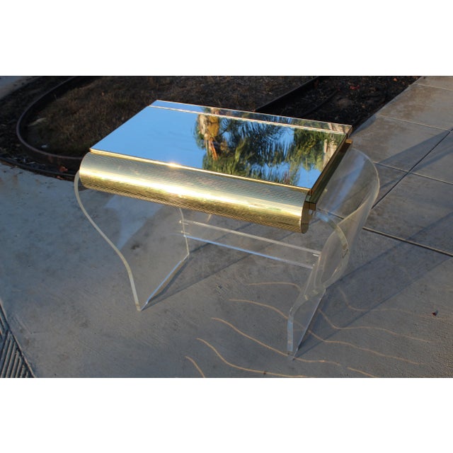 Mid century modern gold and Lucite vanity, possibly by Karl Springer. Note: we have the gold mirror that goes with this.