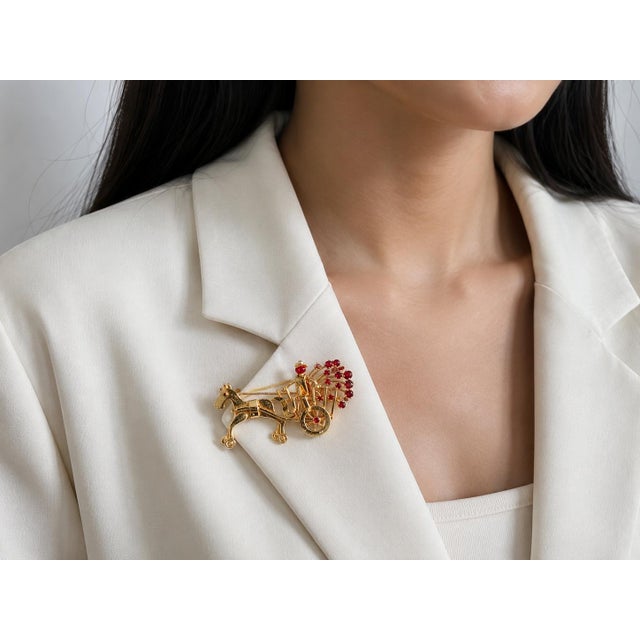 14K pink & yellow gold carriage horse brooch with 16 rubies and fully movable wheels, a whimsical and collectible piece of...