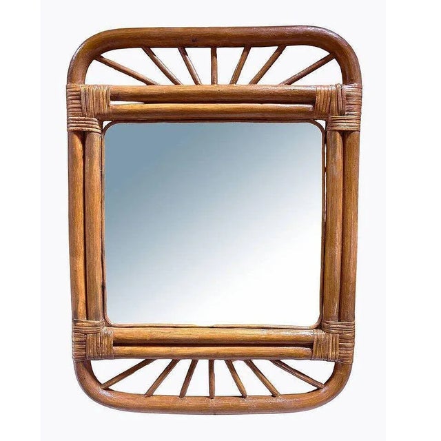Original 1950 single-strand rattan mirror with stick rattan spindle border and woven wicker corners. The mirror features...