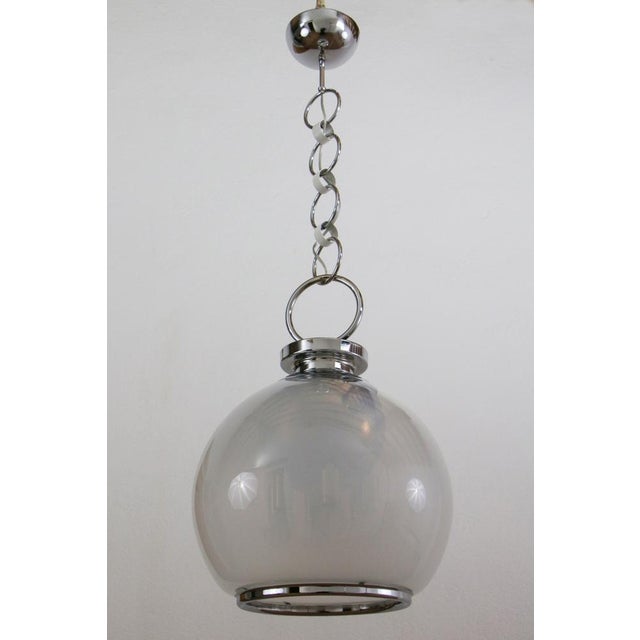This is a beautiful Italian chandelier designed from AV Mazzega in the 1970s. It is made of chrome-plated brass and steel,...