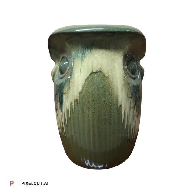 Wonderfully cool 1980’s pottery. Features dual owl faces done in a ombré moss green glazed dripware pottery. The nearly...