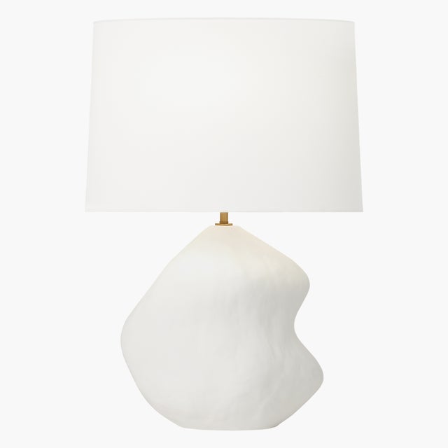 The Broxton one-light table lamp by Hable is hand-built and displays organic indentations. Its shapely, textural form...
