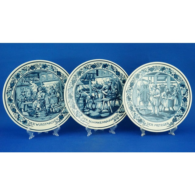 A delightful set of three plates depicting various crafts related to pork processing. Each plate features the name of the...