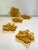 A set of five textured amber glass trinket dishes with looped handles in a whimsical maple leaf shape. Provides a nice...