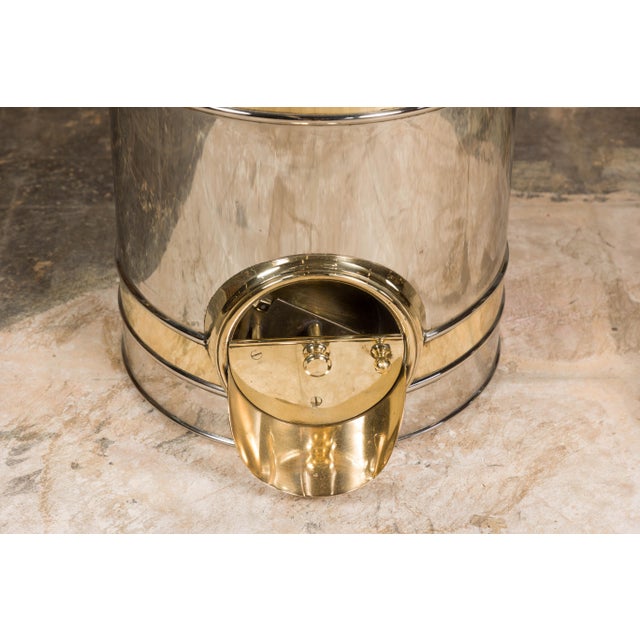 A French 1900s steel and brass coffee bean dispenser from the Turn of the Century. This French Turn of the Century coffee...