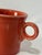 Classic Fiesta Ware ring-handle coffee cup in the warm Persimmon glaze, featuring the iconic concentric detailing around...