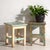 A pair of antique bedside tables in pine wood, with a square top and four tapered legs tied by box stretchers. They...