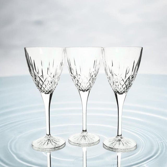 Royal Doulton Earlswood set of three lead crystal goblets produced in England during the Late 20th Century. Each is cut...