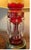 An exceptional late 19th-century Bohemian cranberry glass lustre table lamp featuring richly colored ruby glass decorated...