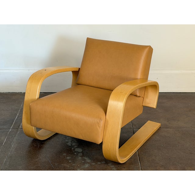 1980's birch and leather Artek 400 tank chair in good vintage condition, nice patinated wood, a burn mark on the wood...
