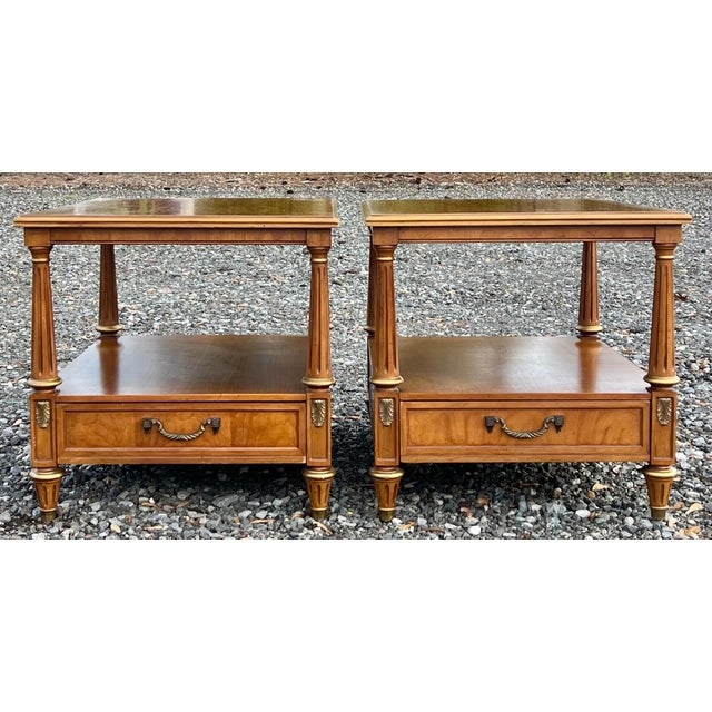 Great pair of Vintage French Regency side tables by Henredon. Nicely turned and fluted legs with gold accents. Drawer for...