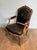 1950s Queen's armchair in carved walnut upholstered with black leather and iron-Gi For Sale - Image 4 of 12