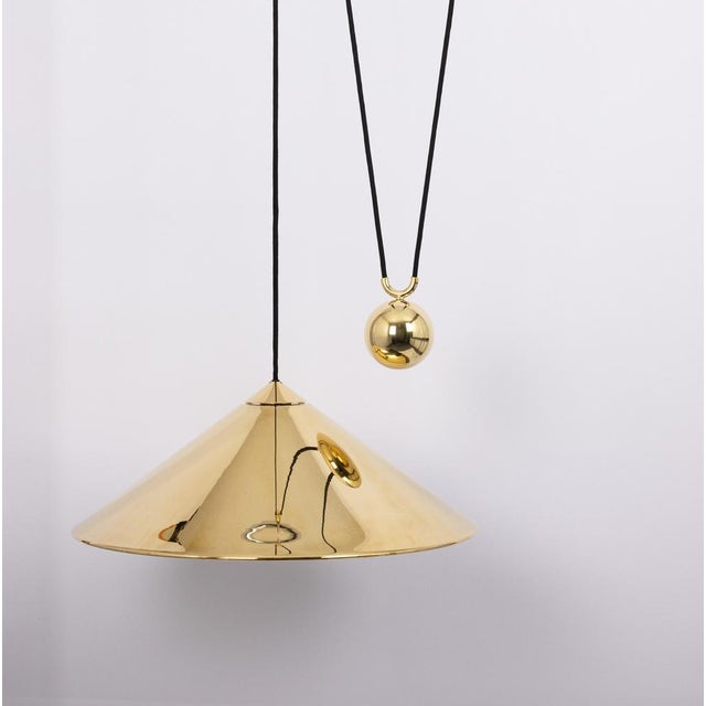 Stunning adjustable counterweight brass pendant lamp keos by florian schulz germany 1970s it is a masterpiece of design...