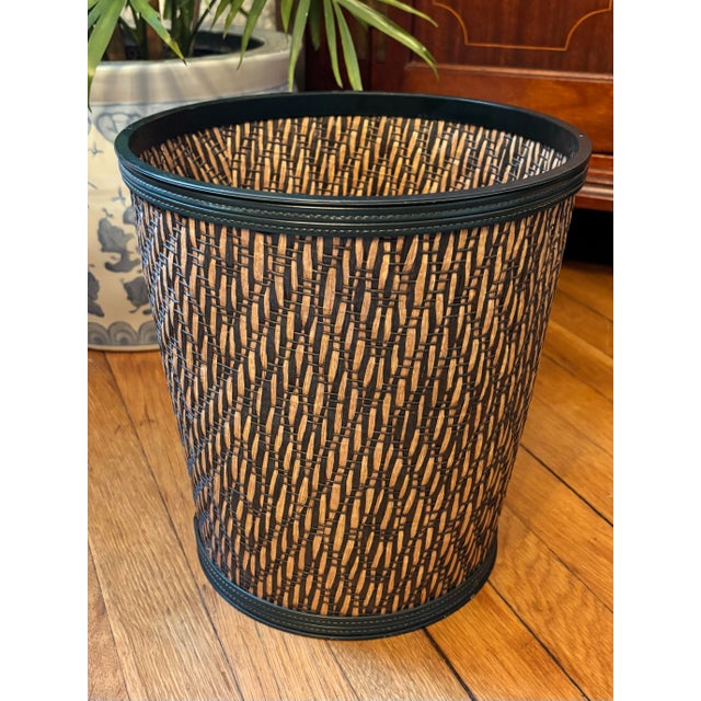Vintage woven two-toned wastepaper basket. Features a natural weave with a dark forest green weave and edge. Most items...