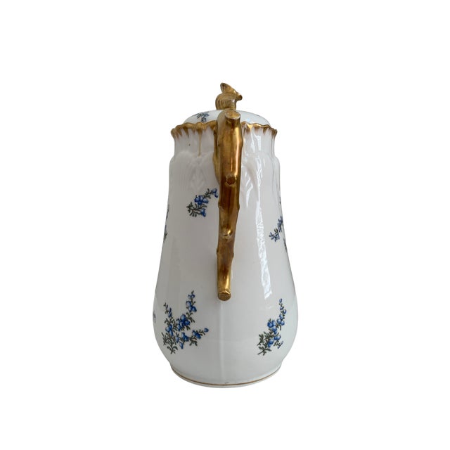 An elegant late-19th-century Limoges porcelain chocolate pot by R. Delinières & Cie, dating to approximately 1894–1900....