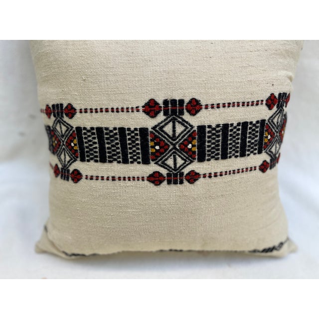A good pillow with tribal motifs.