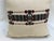 A good pillow with tribal motifs.