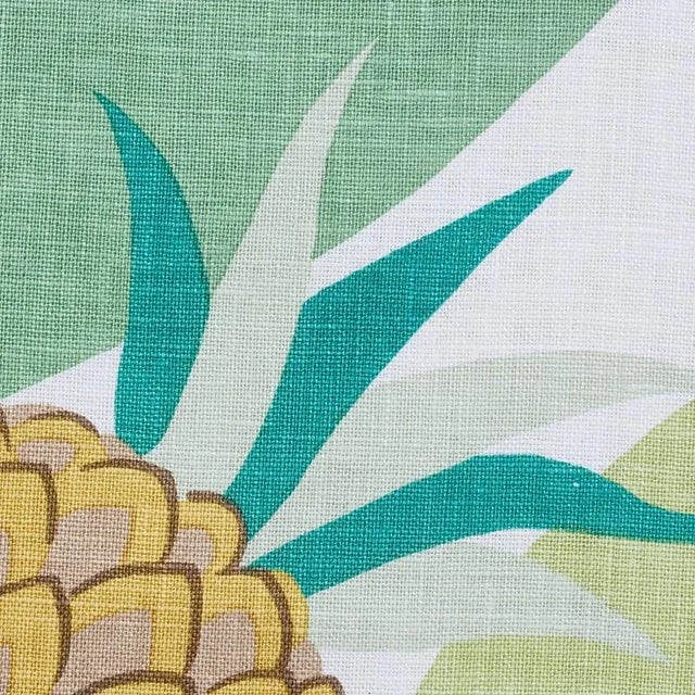 A tropical landscape of pineapples nestled among lush banana leaves, Ananas is a 1930 design that Paul Poiret created...