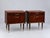 Set of 2 vintage design nightstands with brass details. A stylish set of two vintage design nightstands featuring a warm,...