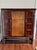 Mid 20th Century Traditional European burlwood and birdseye maple display and storage cabinet featuring Jacobean style...