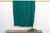 A rare regional variation of West African indigo, featuring saturated teal-green hues and hand-stitched details. This...