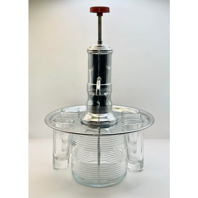 Pump measures 12 3/4 inches tall, 8 inches wide at the tray (glass spots measure 1 1/2 inches), 4 inches wide at the...
